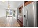 Modern kitchen featuring granite countertops and stainless steel appliances next to a view of the living area at 111 N 12Th St # 1305, Tampa, FL 33602