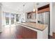 Bright, modern kitchen featuring a large island, stainless steel appliances, and wooden cabinetry at 111 N 12Th St # 1305, Tampa, FL 33602