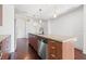 Modern kitchen featuring a large island, updated appliances, and hardwood floors at 111 N 12Th St # 1305, Tampa, FL 33602