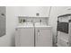 The laundry room has a full-size washer and dryer, plus shelving at 111 N 12Th St # 1305, Tampa, FL 33602