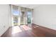 Bright living room with hardwood floors and large windows offering a vibrant outdoor view at 111 N 12Th St # 1305, Tampa, FL 33602