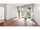 Bright living room with hardwood floors and large windows offering a vibrant outdoor view at 111 N 12Th St # 1305, Tampa, FL 33602