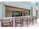 Outdoor bar area with striped seating, offering the perfect spot for entertaining at 111 N 12Th St # 1305, Tampa, FL 33602