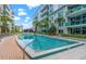 Sparkling pool and building view with meticulously maintained landscaping in a tranquil setting at 111 N 12Th St # 1305, Tampa, FL 33602