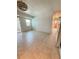 Spacious living room featuring tile flooring and access to the balcony at 11447 Park Blvd # 301, Seminole, FL 33772