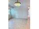 Bright living room with tile floors and a view of the hallway at 11447 Park Blvd # 301, Seminole, FL 33772