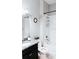 Bathroom featuring a combination tub and shower with a sleek granite vanity and modern fixtures at 11704 Navajo Sandstone St, Riverview, FL 33579