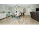 Bright dining area featuring a round glass table, stylish rug, and unique wall decorations at 1290 Pine Ridge E Cir # G1, Tarpon Springs, FL 34688