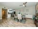 Bright dining area with a round table, modern chairs, and easy access to the kitchen at 1290 Pine Ridge E Cir # G1, Tarpon Springs, FL 34688