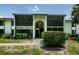 A Two-story condo building with screened in patios on both levels, great natural light at 1290 Pine Ridge E Cir # G1, Tarpon Springs, FL 34688