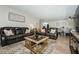 Spacious living room featuring modern furnishings, hardwood floors, and an open layout at 1290 Pine Ridge E Cir # G1, Tarpon Springs, FL 34688