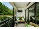 This spacious patio has a comfortable seating area and a view of the pond and mature trees at 1290 Pine Ridge E Cir # G1, Tarpon Springs, FL 34688