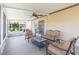 Outdoor Lanai with furniture and fan at 13023 Waterbourne Dr, Gibsonton, FL 33534