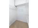 Bright walk-in closet featuring metal shelving for efficient storage and organization at 13023 Waterbourne Dr, Gibsonton, FL 33534