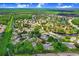 An aerial perspective showcasing the condo's location within a neighborhood surrounded by canals and lush greenery at 134 Sycamore Ln # F, Oldsmar, FL 34677
