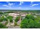 A beautiful aerial view of the neighborhood and commercial area with stunning blue sky and picturesque lake views at 134 Sycamore Ln # F, Oldsmar, FL 34677