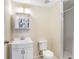 Neat bathroom featuring a single sink vanity and a walk-in shower with white tiling at 134 Sycamore Ln # F, Oldsmar, FL 34677