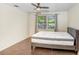 Bright bedroom with a large window and a comfortable mattress on a modern bed frame at 134 Sycamore Ln # F, Oldsmar, FL 34677