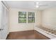 Comfortable bedroom featuring a trundle bed and a closet, bathed in natural light from the window at 134 Sycamore Ln # F, Oldsmar, FL 34677