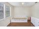 Bright bedroom featuring a trundle bed and storage, with natural light and an airy feel at 134 Sycamore Ln # F, Oldsmar, FL 34677