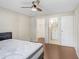 Cozy bedroom with a view into the closet and bathroom, with a ceiling fan, and a comfortable mattress at 134 Sycamore Ln # F, Oldsmar, FL 34677