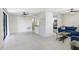 Bright and spacious living room with tile floors, ceiling fan, and an open floor plan at 134 Sycamore Ln # F, Oldsmar, FL 34677