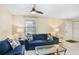 Comfortable living room with tile floors, ceiling fan, and a cozy seating area with lamps at 134 Sycamore Ln # F, Oldsmar, FL 34677