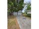 Detached two-car garage with gated parking area at 1412 Sunset Ln, Lutz, FL 33549