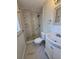Modern bathroom with a tiled shower, updated vanity, and contemporary fixtures at 1412 Sunset Ln, Lutz, FL 33549