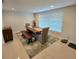 Dining room with lots of natural light and seating for four at 1412 Sunset Ln, Lutz, FL 33549