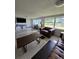 Comfortable living room with tile floors, large windows and plenty of seating at 1412 Sunset Ln, Lutz, FL 33549