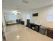 Spacious living room with tile floors, natural light and fan lighting at 1412 Sunset Ln, Lutz, FL 33549