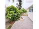 Backyard features a stone fire pit and plenty of green foliage at 1415 Beach Club, Apollo Beach, FL 33572
