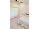 Well-lit bedroom featuring a ceiling fan, closet, bedside table, and comfortable bed at 1415 Beach Club, Apollo Beach, FL 33572