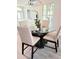 Bright dining area with table, chairs, and a view to the living room at 1415 Beach Club, Apollo Beach, FL 33572