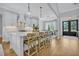 Modern kitchen with a large island, stainless steel appliances, and open layout at 14902 Sweat Loop Rd, Wimauma, FL 33598