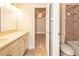 Bathroom featuring tiled floors, granite countertops, and a ceiling fan at 16226 Bayberry View Dr, Lithia, FL 33547