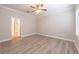 Spacious bedroom with wood-look floors, a ceiling fan, and neutral paint, offering a calm retreat at 16226 Bayberry View Dr, Lithia, FL 33547