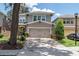 Charming two-story home features a neutral-colored exterior, brick-paved driveway, and a well-manicured lawn at 16226 Bayberry View Dr, Lithia, FL 33547