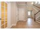 Open foyer with tile flooring and staircase, creating a welcoming and bright entryway at 16226 Bayberry View Dr, Lithia, FL 33547