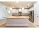 Modern kitchen equipped with stainless steel appliances, granite countertops, and a central island at 16226 Bayberry View Dr, Lithia, FL 33547