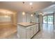 Open-concept kitchen featuring granite countertops and a central island perfect for entertaining at 16226 Bayberry View Dr, Lithia, FL 33547