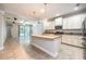 Spacious kitchen featuring an island, granite countertops, stainless steel appliances, and pendant lighting at 16226 Bayberry View Dr, Lithia, FL 33547