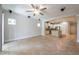 Bright and airy living room that seamlessly transitions into a modern kitchen and dining area at 16226 Bayberry View Dr, Lithia, FL 33547
