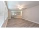 Upstairs loft with wood-look floors, large windows, and a ceiling fan for a comfortable space at 16226 Bayberry View Dr, Lithia, FL 33547