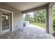 Charming covered patio with brick pavers offers an inviting outdoor space for relaxation and entertaining at 16226 Bayberry View Dr, Lithia, FL 33547