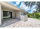 Stylish covered patio with brick flooring, offering a seamless transition to the backyard for outdoor enjoyment at 16226 Bayberry View Dr, Lithia, FL 33547