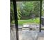 Picturesque view from the back patio overlooking lush greenery and a pond at 16530 Brigadoon Dr, Tampa, FL 33618