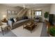 Bright living room with neutral tones, cozy seating, and natural light at 16530 Brigadoon Dr, Tampa, FL 33618