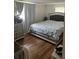 Cozy bedroom featuring natural light and a comfortable queen-sized bed at 192 Tulane Rd, Venice, FL 34293